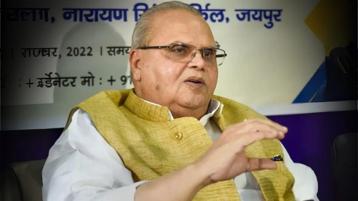 Satyapal Malik, former Jammu and Kashmir Governor, speaking at a public event wearing a yellow jacket.